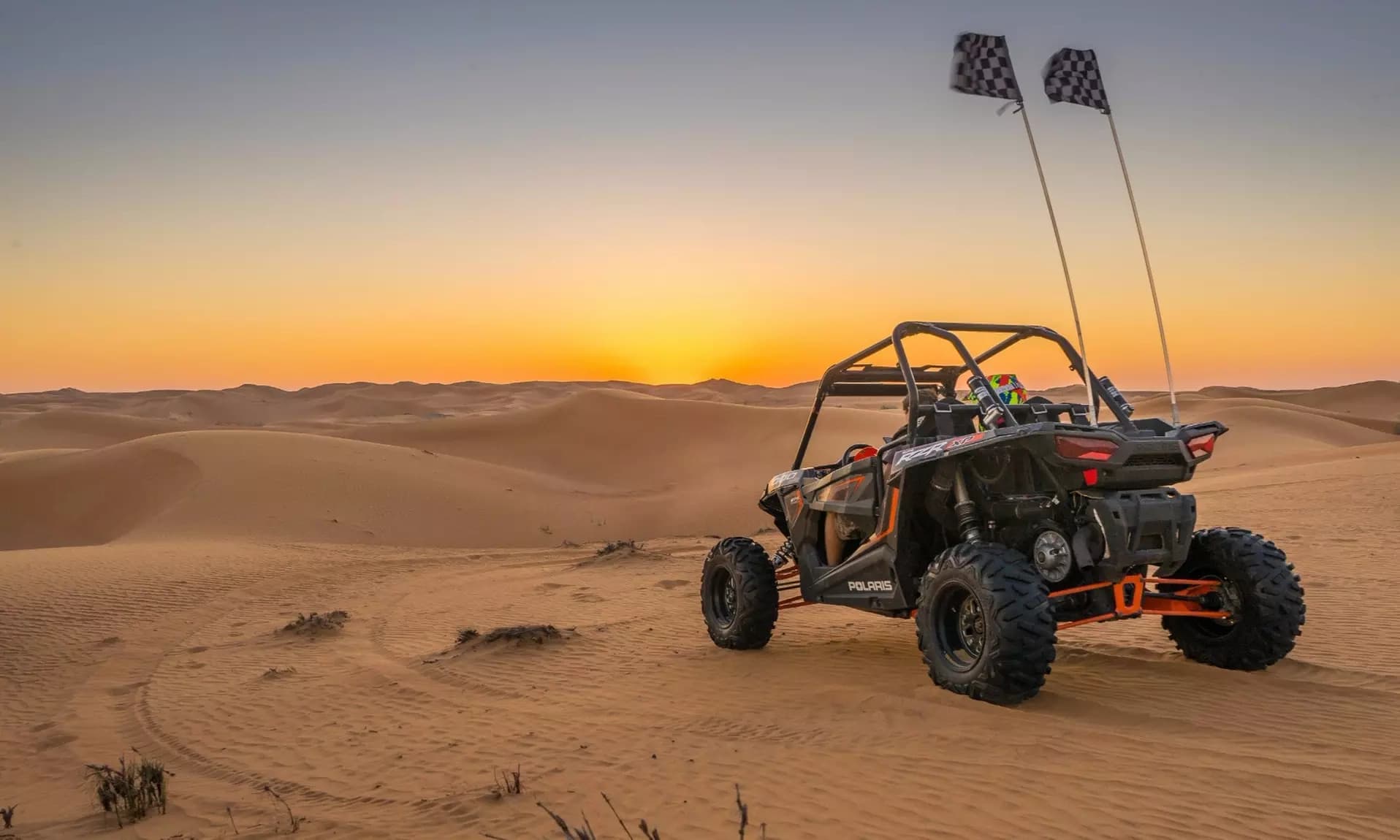 Buggy driving across the Sahara dunes