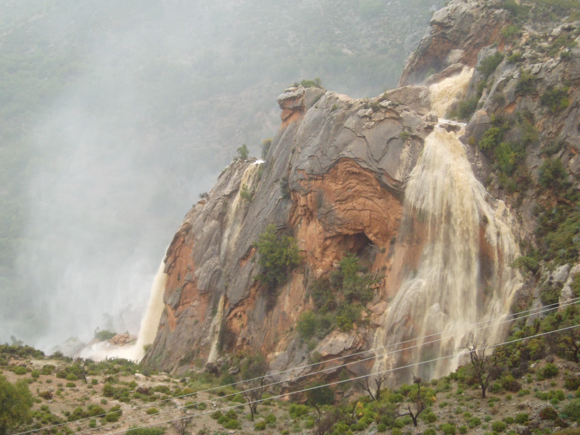 Imouzzer waterfall pouring down the rock face