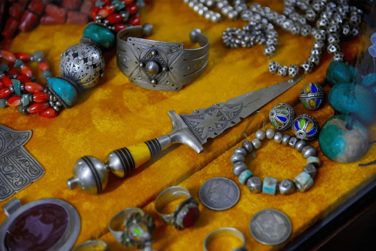 Traditional Moroccan silver jewelry displayed in an artisan souk in Tiznit