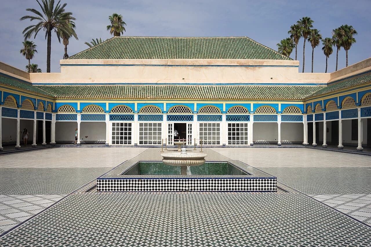 Courtyard of the Bahia Palace with a marble fountain, zellij paving and painted arcades