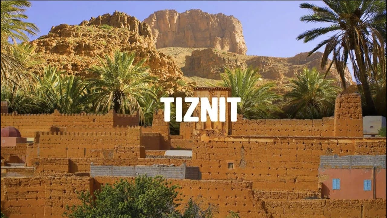 Earthen ramparts of the old town of Tiznit below a rocky hill