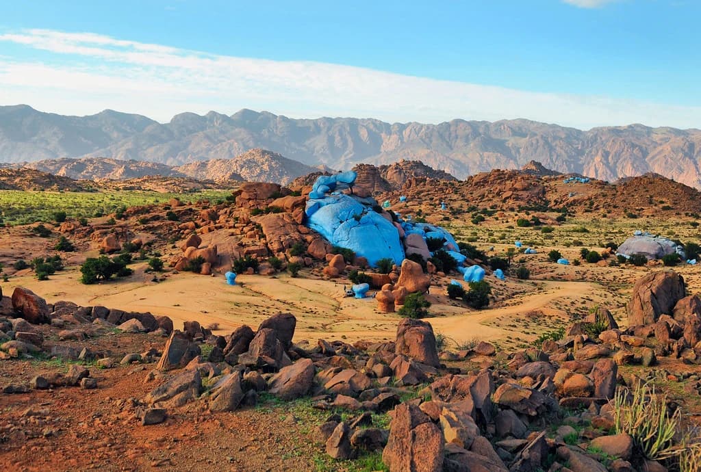 Blue and pink painted granite boulders near Tafraout